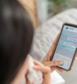 close-up-of-woman-patient-using-phone-apps-consult-2025-03-26-21-21-18-utc